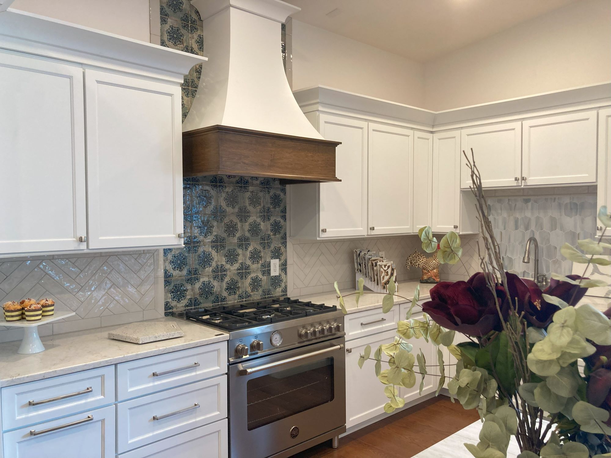 Kitchen Remodel with Statement Tile Stove Backsplash and Custom Range Hood