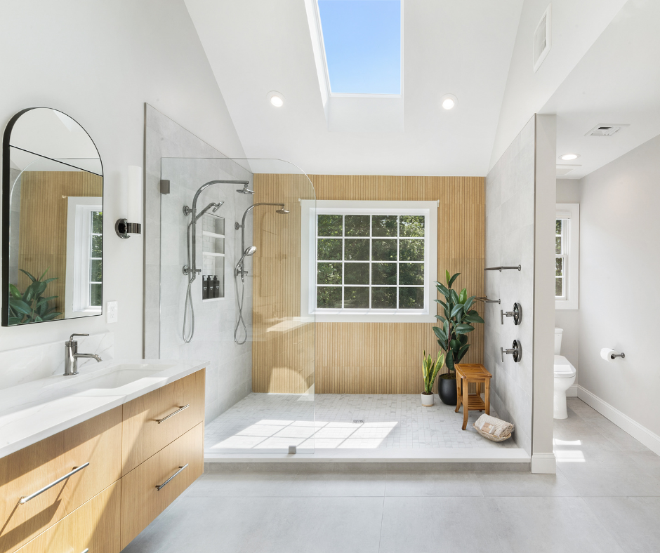 Modern spa-style bathroom featuring a walk-in shower with glass enclosure, natural lighting, warm wood accents, and sleek finishes for a relaxing, retreat-like atmosphere.